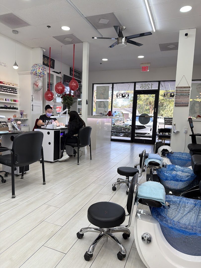 Salon chairs and styling stations in a bright beauty space.